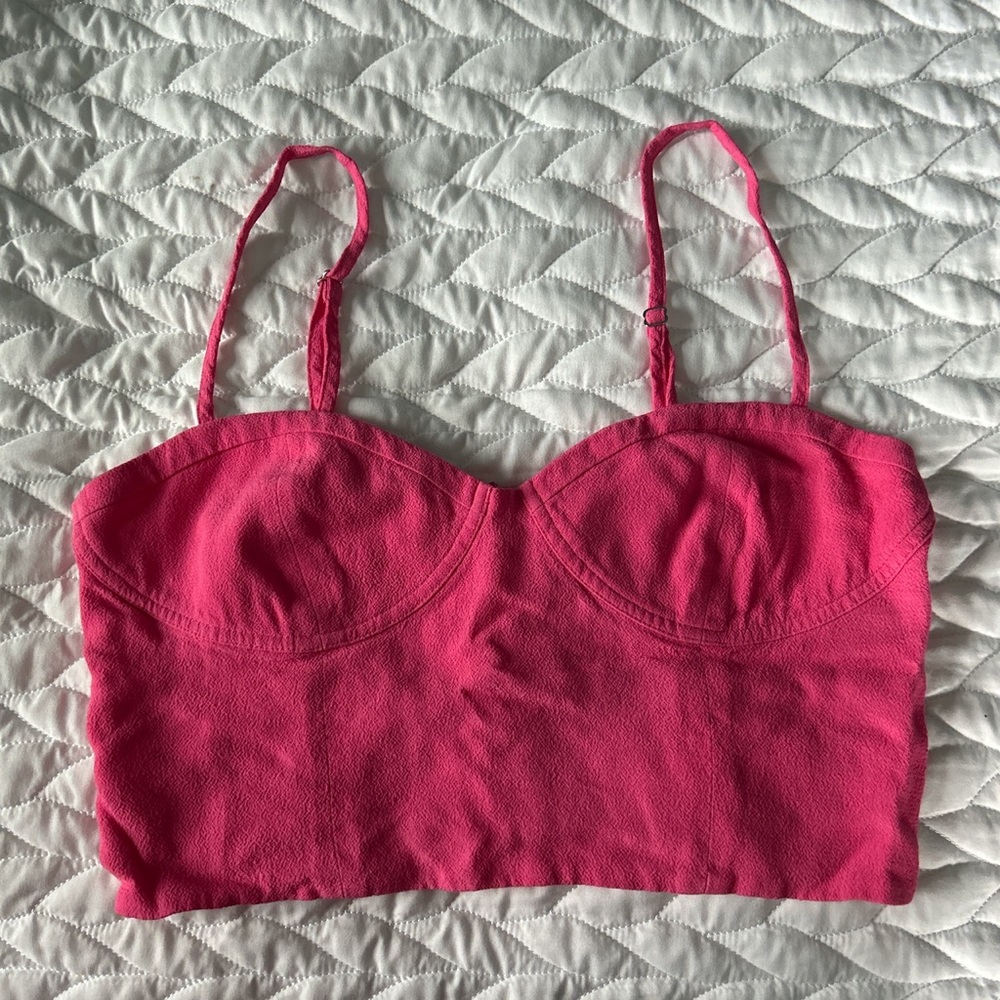A cute pink top from Aritzia that was worn once! Size small and true to size.